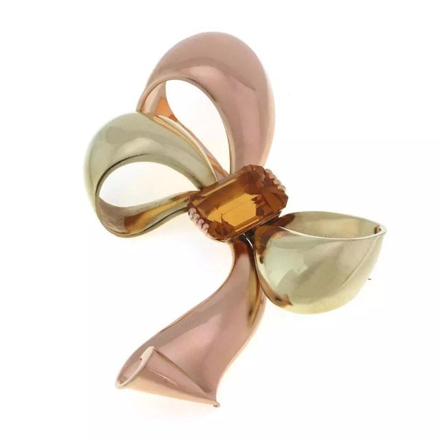 This is an impressive large authentic vintage brooch from Tiffany & Co. It is crafted from 18k yellow and rose gold show a...