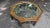 A striking vintage octagonal coffee table that blends elegant form with exquisite Chinoiserie detailing. The standout...