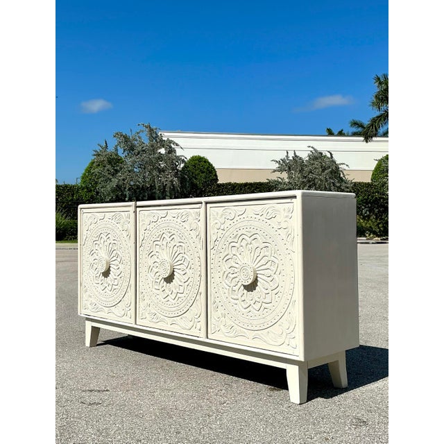 This exquisite vintage credenza serves as a stunning focal point, blending global artisanal craftsmanship with a clean,...