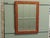 Red and Gold Lacquer Chinoiserie Wall Mirror This charming mirror has delightfully etched and painted gold chinoiserie...