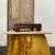 Early 20th Century Rosewood display stand with removable slatted inset panels rating on four tapered feet. Contrasting...