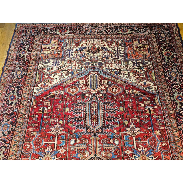 "This magnificent oversized Persian Heriz Serapi rug, woven in the Azerbaijan region of Northwest Persia, exemplifies the...