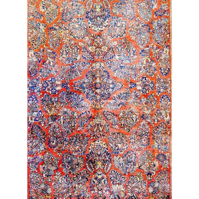A wonderful early 20th century Persian Sarouk rug with a beautiful all-over mirror floral pattern woven in light and dark...