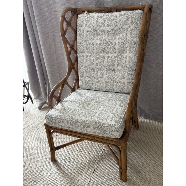 The Watson Chair features an elegant, open-weave design crafted from natural rattan, providing both durability and style....