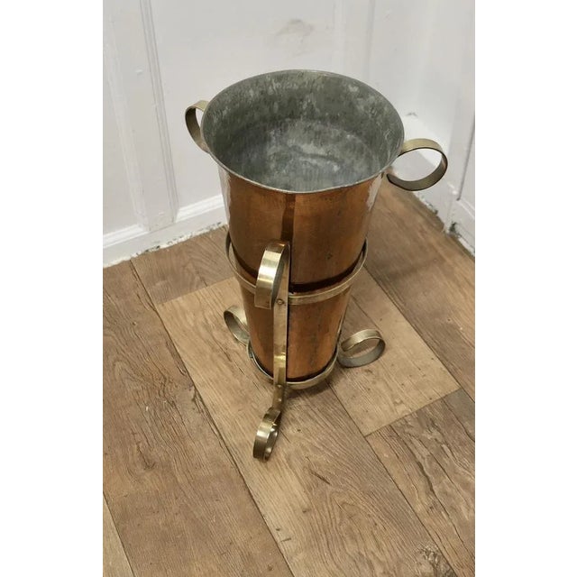 Arts and Crafts Copper and Brass Umbrella Stand An unusual and attractive piece, the copper receptacle is set in a very...