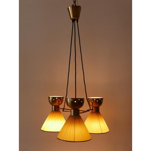 Extremely rare, highly decorative and elegant mid-century modern 6-flamed pendant lamp or chandelier with diabolo lamp...