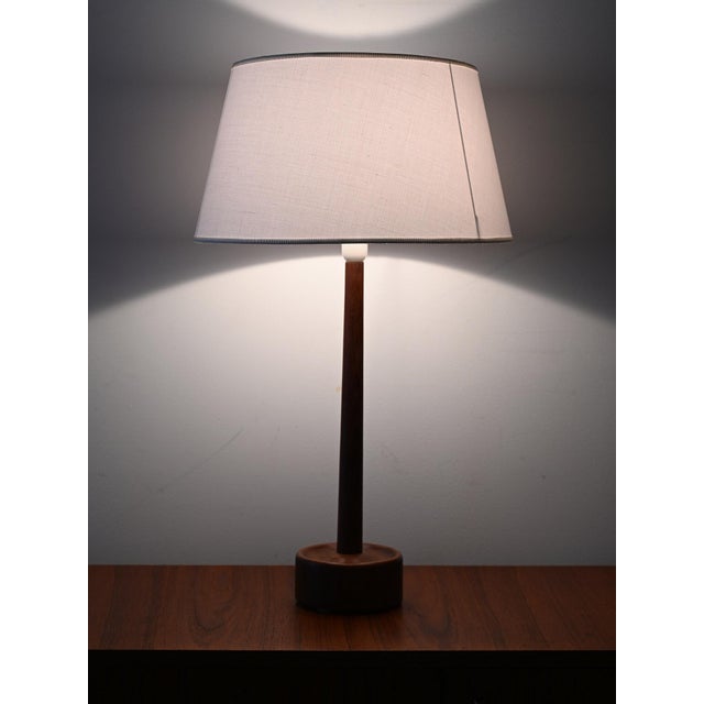 Teak table lamp with fabric lampshade. Danish design from the 1950s/60s, restored lampshade. Danish design table lamp made...