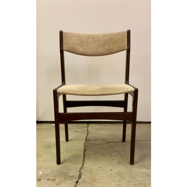 A set of six mid century modern teak dining chairs with off grey upholstry. Made in Denmark