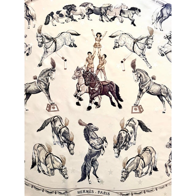 HERMES En Piste 1998 designed by Robert Dallet This Hermes scarf offers a beautiful tribute to the world of the circus. At...