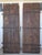 Great looking very heavy rustic doors with old hand forged iron hinges . Each one is 30.5" wide making the pair 61"wide.