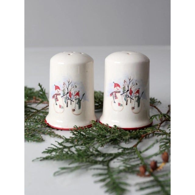 Add a touch of festive cheer to your holiday table with this pair of vintage Christmas snowman salt and pepper shakers by...