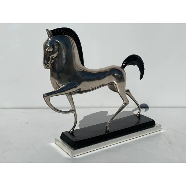 Art Deco style silvered brass Etruscan horse sculpture on 12-karat white gold leaf base.