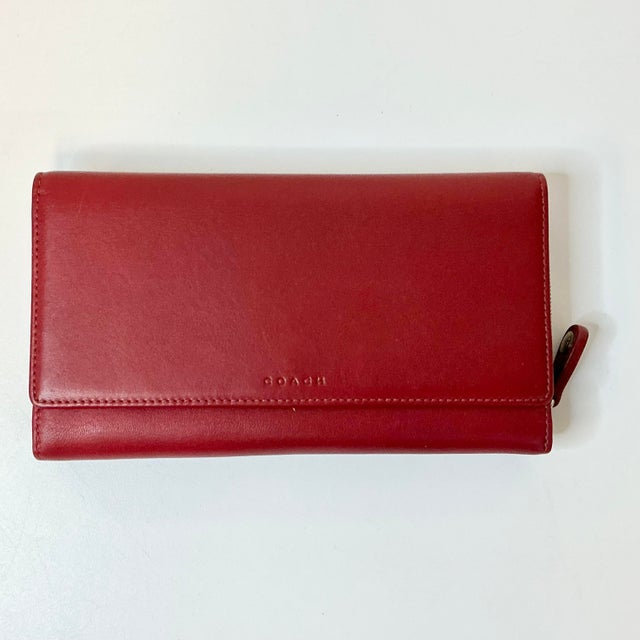 Vintage Home is pleased to offer this 1996 Red Leather Coach Tri-Fold Wallet. It features compartments for your checkbook,...
