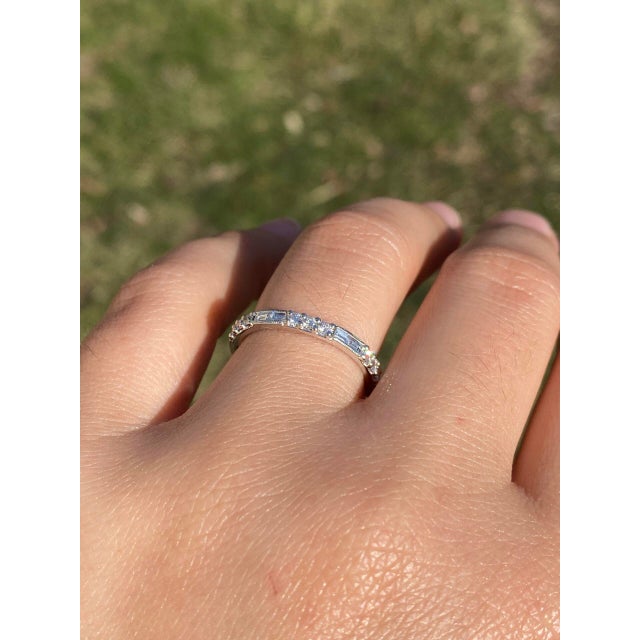 The Riel: Gabriel and Company Signed Band with Natural Diamonds in White Gold. This exquisite ring showcases a captivating...