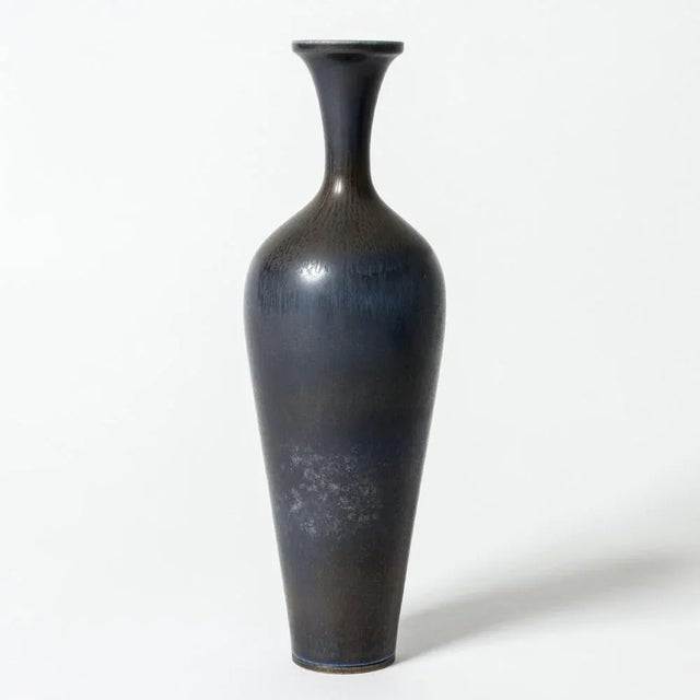 Stoneware vase by Berndt Friberg, in an elegant sleek form. Beautiful dark blue hare’s fur glaze. This piece has an...