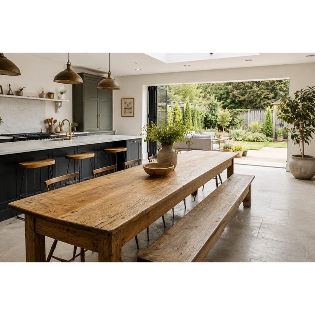 A truly impressive English farmhouse harvest table of monumental proportions, featuring a beautifully timeworn pine plank...