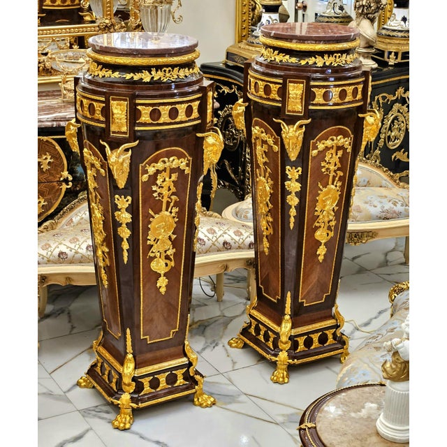 Make a bold statement with this luxurious oversized wood pedestal, exquisitely crafted with intricate gold leaf detailing,...
