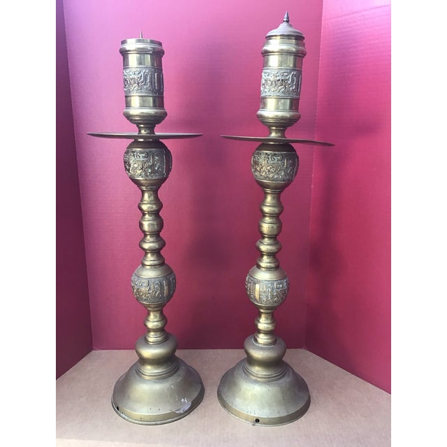 A striking pair of 31 inch mid century Asian brass altar, candlesticks, acquired in the 1960s in Hong Kong/Vietnam. These...