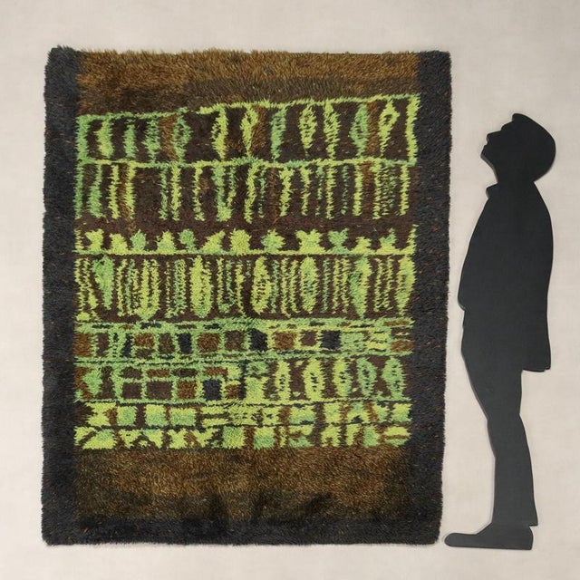 Vintage wool rug, large knot, machine made. This piece is attributed to the mentioned designer/maker. It has no...