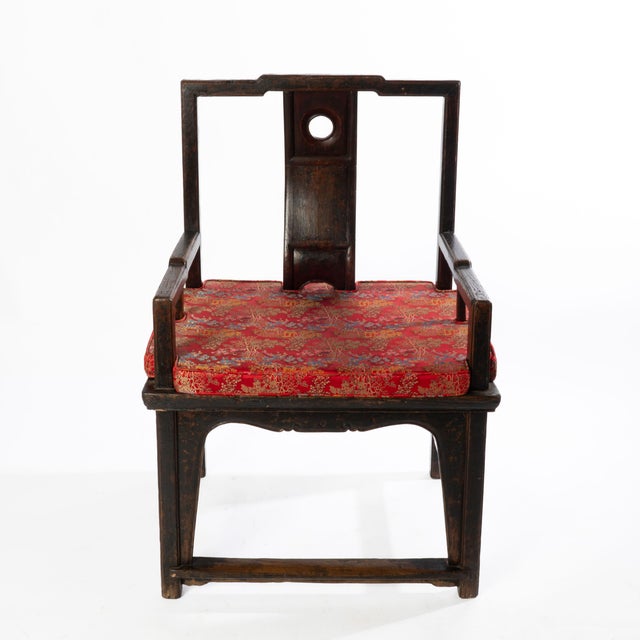 This over sized antique chair has a wonderful old finish with great patina. It has good lines and strong character.