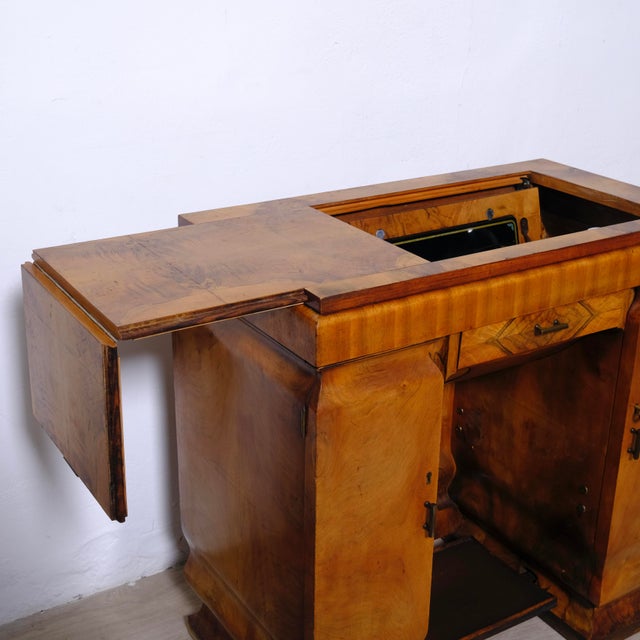 A. Vigorelli Pavia sewing machine, with a beautiful 1930s Art Deco wooden cabinet, with doors and original side drawers,...