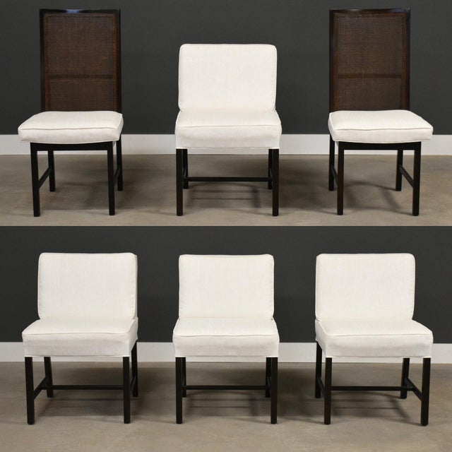 A beautiful set of extremely well made six mid century modern dining chairs with ebonized frames and new white fabric. Two...