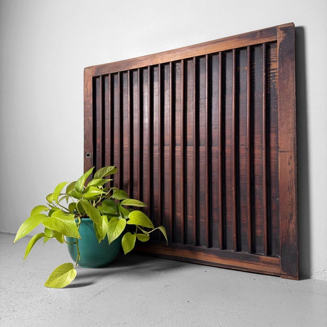 This antique Japanese door panel, originally part of a piece of furniture, has a distinctly architectural presence thanks...