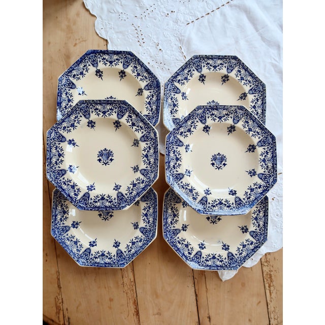 Superb set of six Longchamp ironstone soup plates, Rouen pattern, late 19th century. Their delicate blue decoration and...