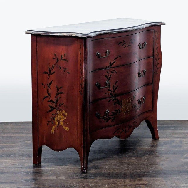This Drexel Heritage dresser features three spacious drawers and beautiful hand-painted floral designs on a rich wood...