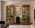 An impressive matched pair of vintage display cabinets by Mastercraft of Grand Rapids, featuring the glamorous brass-and-...