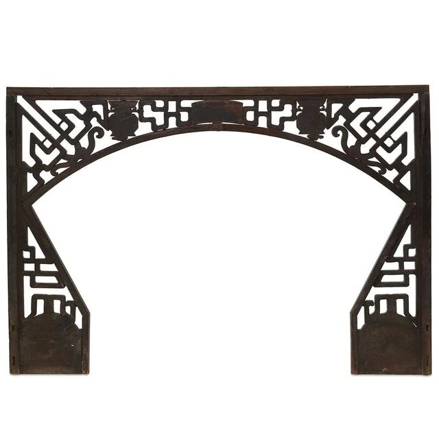 This unique arched panel, crafted from beech wood and featuring intricate geometric designs, dates back to circa 1850 in...