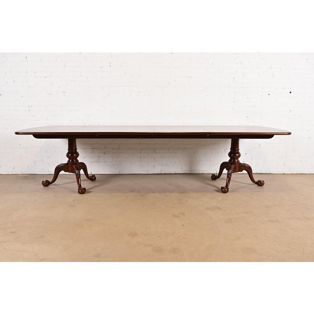 An exceptional Georgian or Chippendale style double pedestal extension dining table By Henredon USA, Circa 1980s Gorgeous...