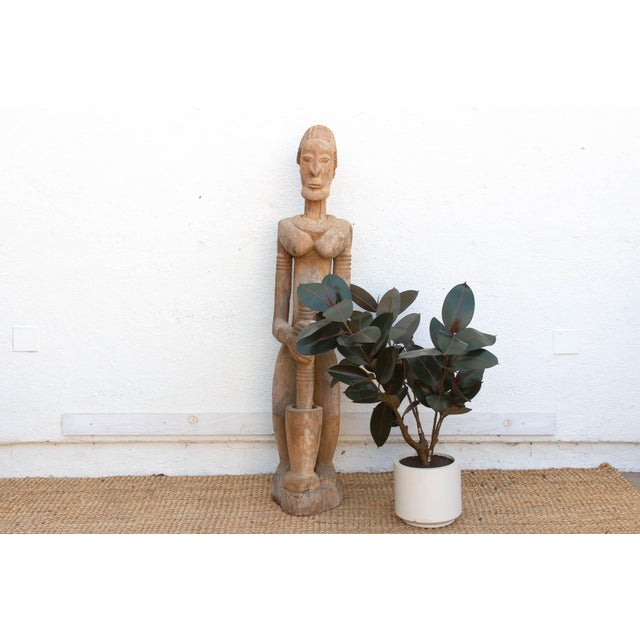 This commanding 63-inch statue is a rare and significant example of Baule sculptural art from the Ivory Coast. In Baule...