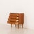 This Danish vintage teak chest of drawers comes from the late 1960s or 1970s. The dresser represents a classic mid-century...