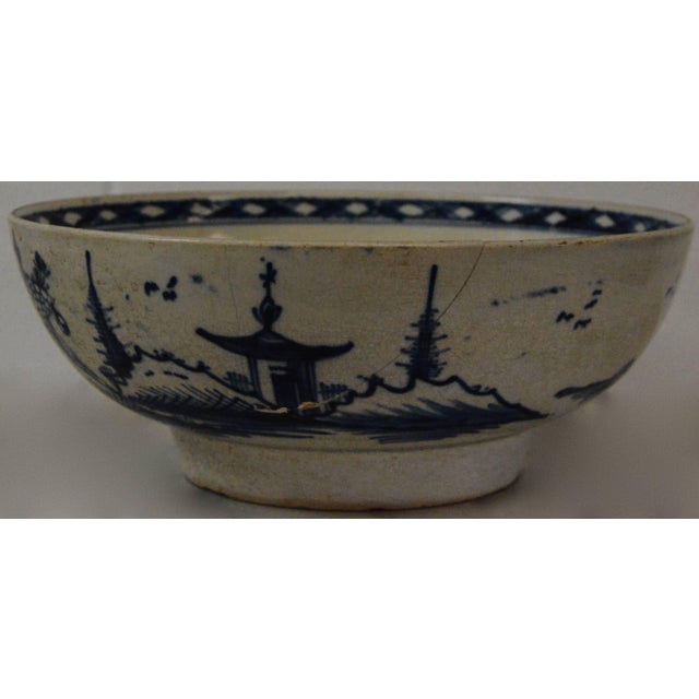 We are offering you a beautiful Oriental bowl done in white porcelain with blue hand-painted scenes. This bowl originates...