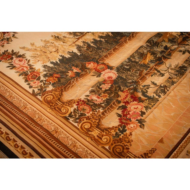 This antique rug is a refined European Tapestry from circa 1875, representing a sophisticated form of 19th-century textile...
