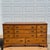This is a 1960s early colonial style solid maple dresser and matching mirror, which Leo Jiranek designed for Bassett...