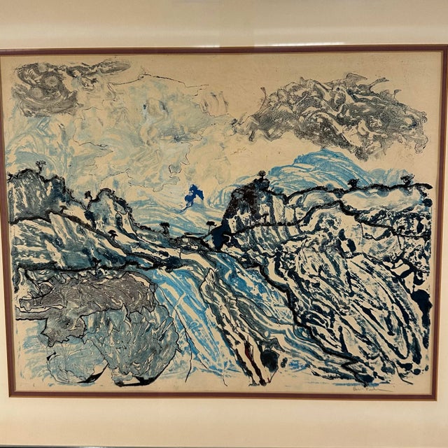 This is a framed, abstract style landscape lithograph. We believe it depicts a landscape scene with rolling hills, trees...