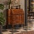 Early 20th-century style bureau crafted in walnut, featuring a two-drawer front with a drop-leaf mechanism. The upper...