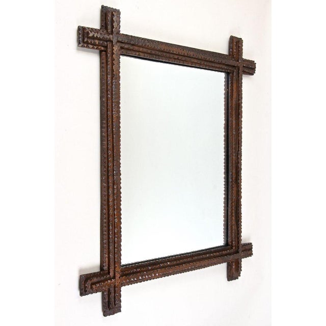 Beautiful rustic Tramp Art mirror from the 19th century in Austria. This unique rural wall mirror from around 1860...