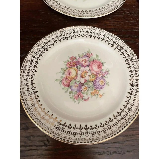 Offered is a lovely vintage set dessert plates by The Edwin M Knowles China Co. This set features a floral design with 22...
