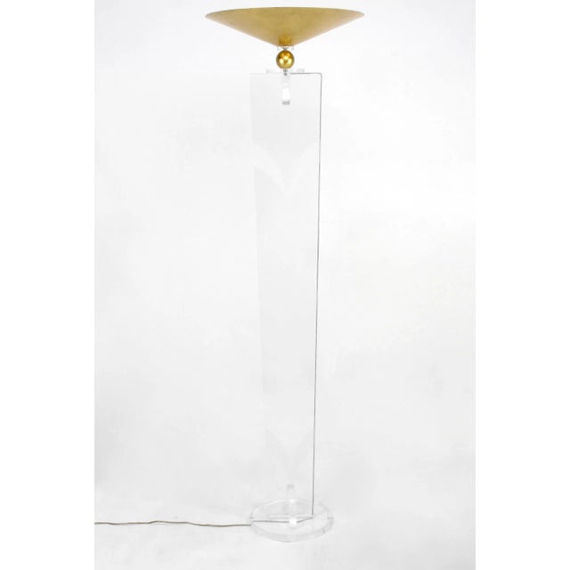 Pair of tall and elegant Lucite torchieres with gilt metal reverse shades by Lucite artist Hivo Van Teal. Tapered bodies...