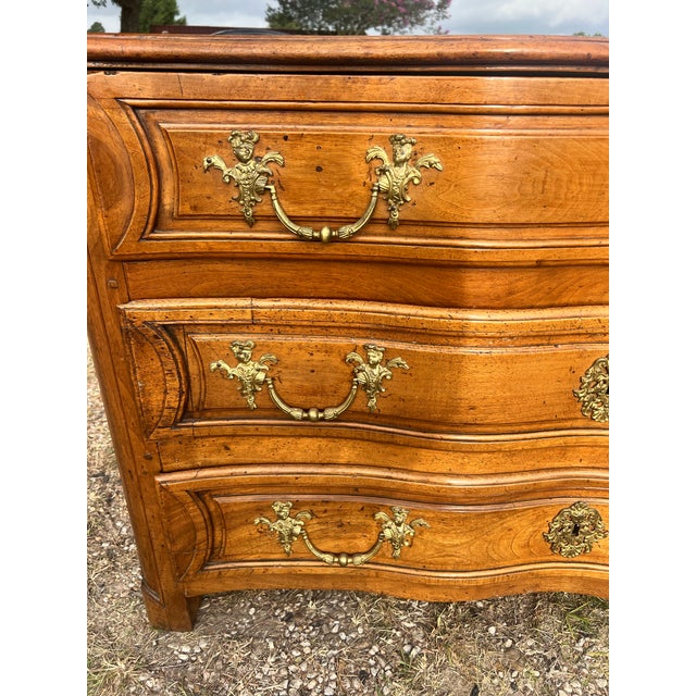 An elegant 19th-century French Louis XV commode, crafted from solid walnut with beautifully figured walnut veneer. This...