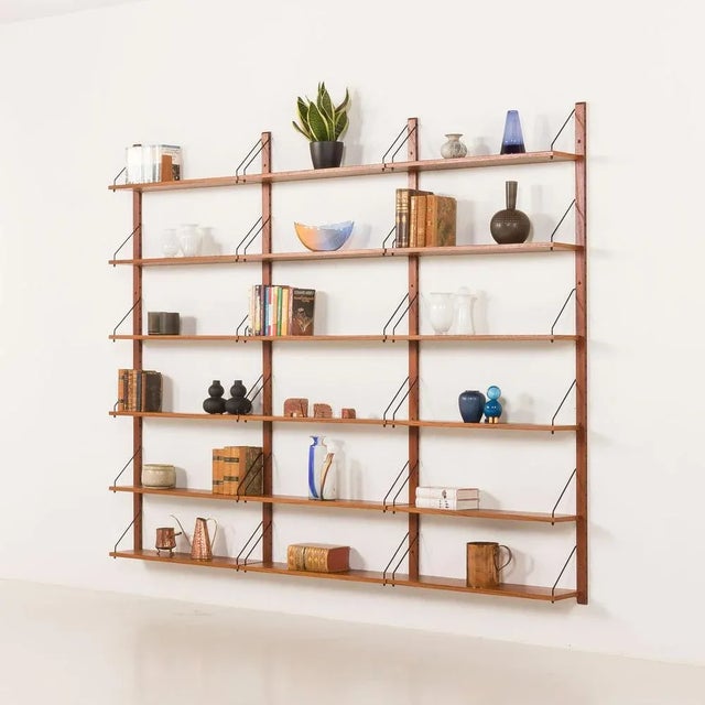 Impressive modular teak shelving unit, made some time in the 1970s in the style of Poul Cadovius. It has been fully...
