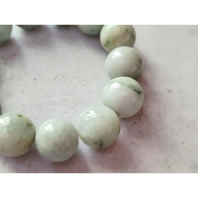 Fabulous Jade bracelet! The bracelet is 9 inches long (22.8 cm) and weighs 115 grams (4 oz). The smooth round beads are...