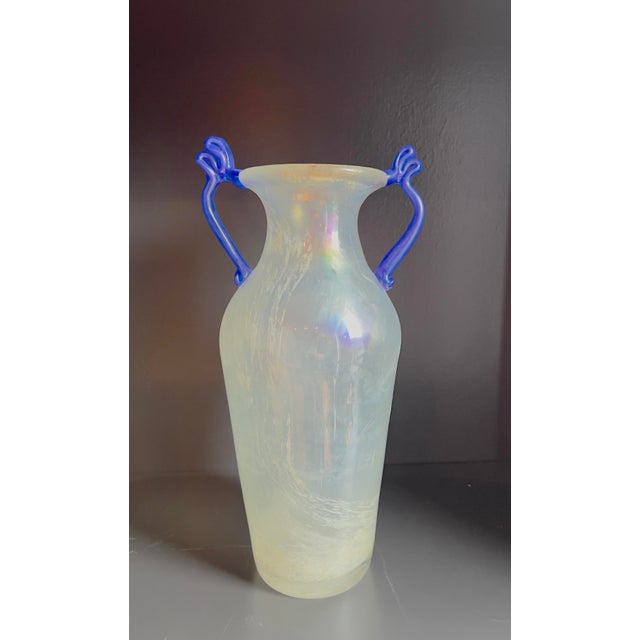 This striking 12" mid-century Italian art glass amphora vase features a scavo finish in iridescent white with vivid, hand-...