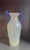 This striking 12" mid-century Italian art glass amphora vase features a scavo finish in iridescent white with vivid, hand-...