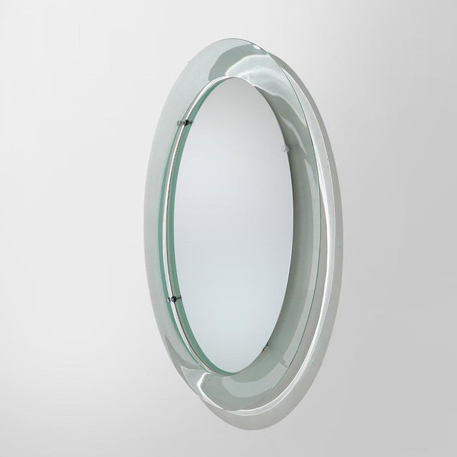 A wall mirror produced by Metalvetro in the 1970s, built around the relationship between transparency, reflection and...