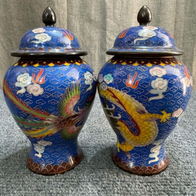 Description: A lovely small pair of Chinese Cloisonné Enamel "General Jars." One jar features a vibrant yellow dragon and...
