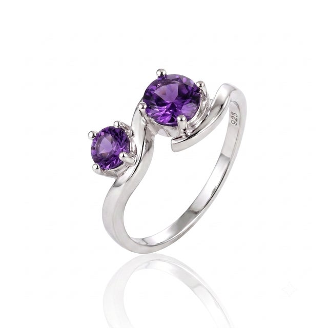 Designed around a graceful S-curve motif, this bypass style pairs two rich purple gems in a sleek setting that blends...